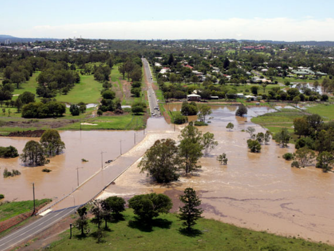 The Bremer River bursts over the Old Toowoomba Road Bridge at Leichhardt, Ipswich. Photo Bruce Long